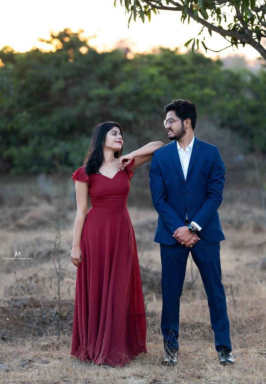 Prewedding photoshoot of couple walking together outdoors